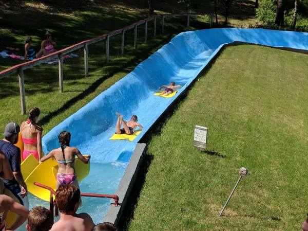 Water Slide Fun On Outdoor Pool Relax Leisure Action Photo