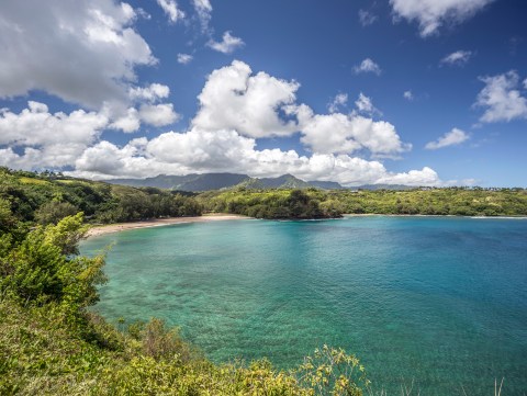 The Breathtaking Hawaii Beach Surrounded By Lava Cliffs That's Tailor Made For Summer