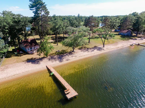 This Little Cottage On Wolf Lake Is Steps Away From A Sandy Beach, And You Can Spend The Night
