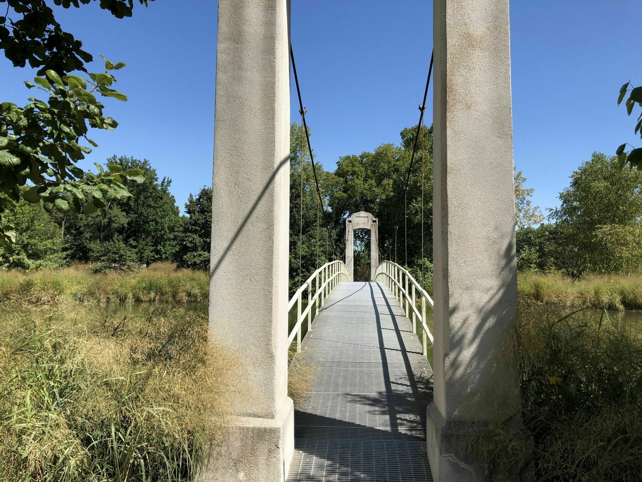 walk-across-a-suspension-bridge-on-picnic-island-loop-trail-in-missouri
