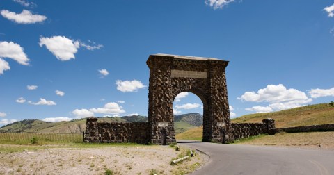 This rock arch entrance to Yellowstone National Park is the original entrance to the park entering from Montana.The signs on the arch and the greeting lets everyone know they are welcome.